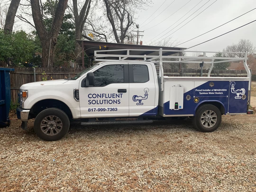 Confluent Solutions service truck with branding and water heater installation equipment.